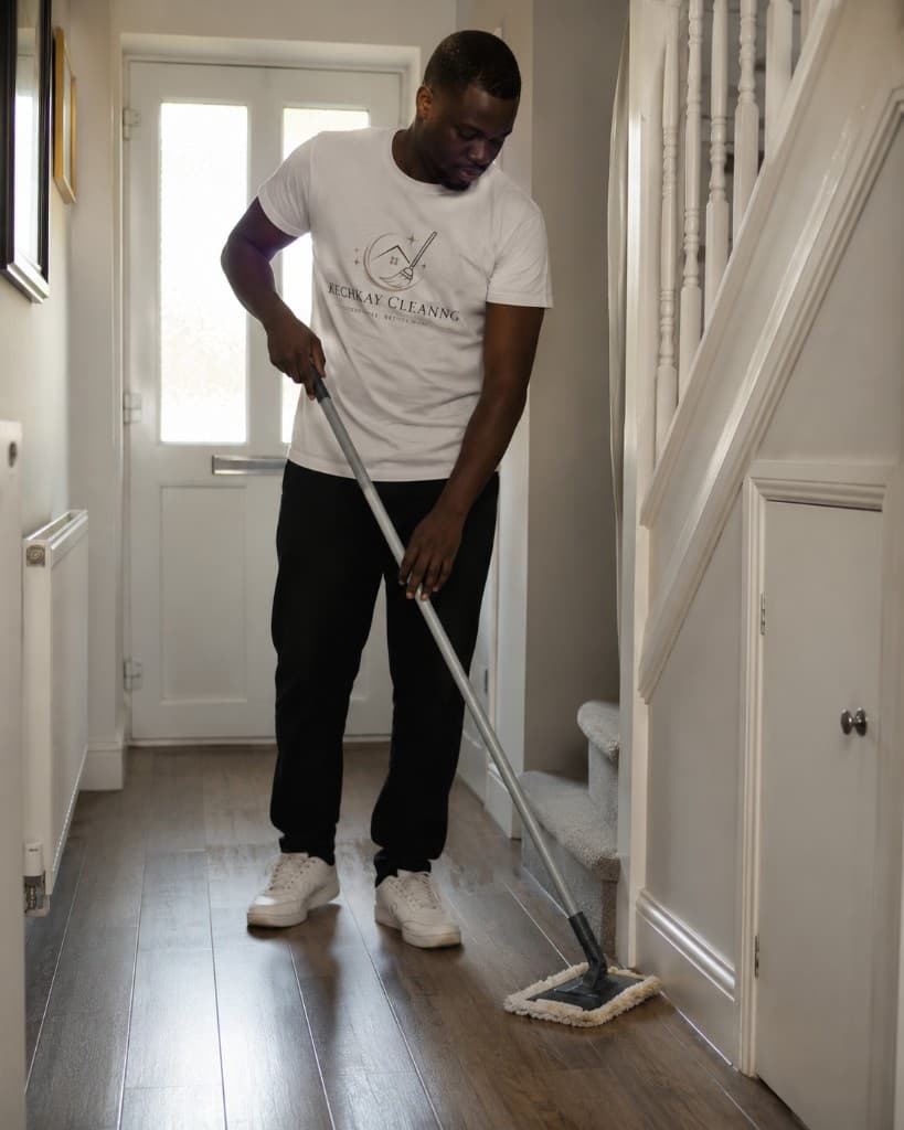 Kechkay cleaner mopping a hallway floor